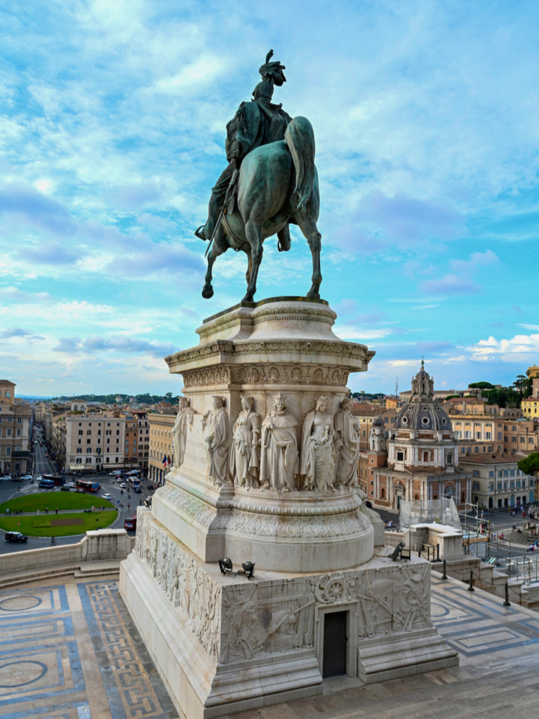 An enormous bronze horseback statue of Victor Emmanuel II is centrally located in front of the Altare della Patria monument.