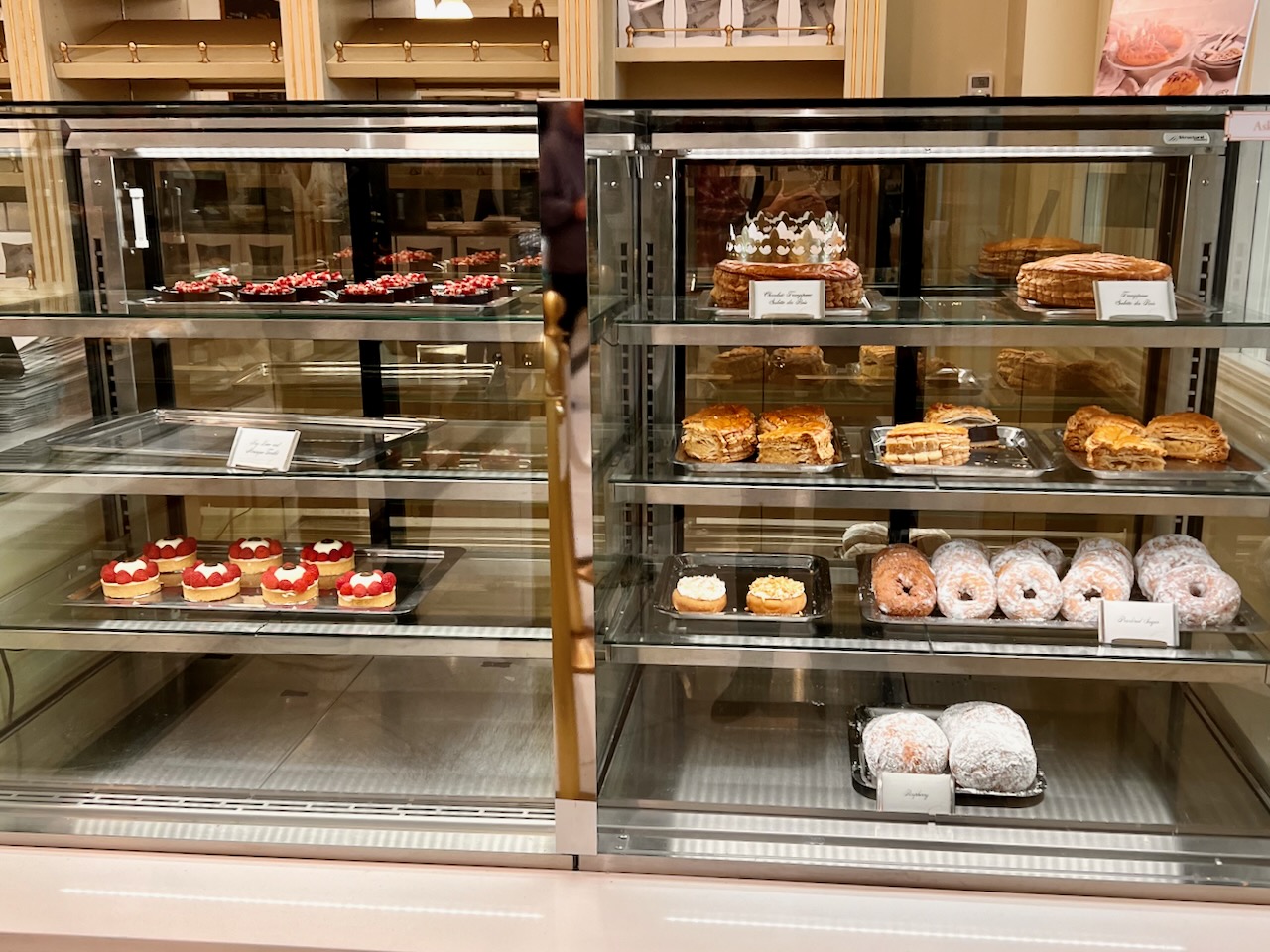 Sweet treats in a bakery showcase.