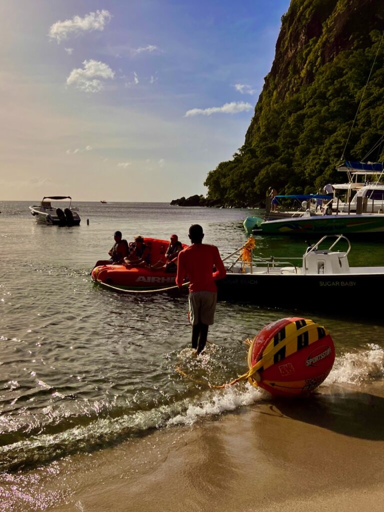 A group preparing for a water ride behind a boat at the Sugar Beach Resort in Saint Lucia.