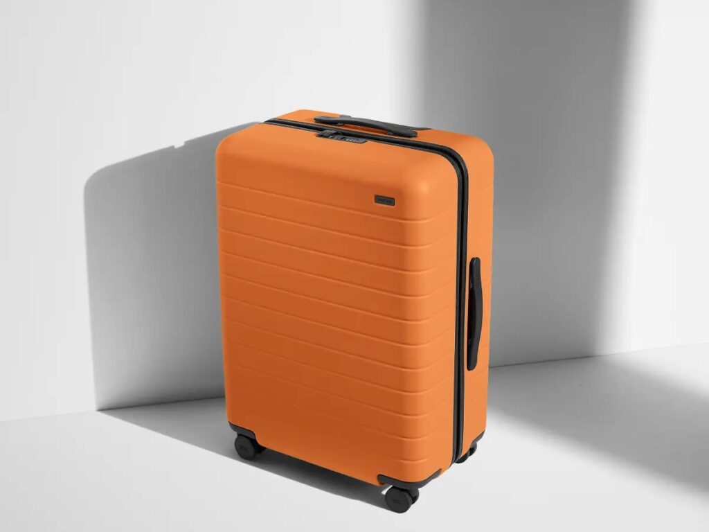 The medium size Away brand suitcase in orange.